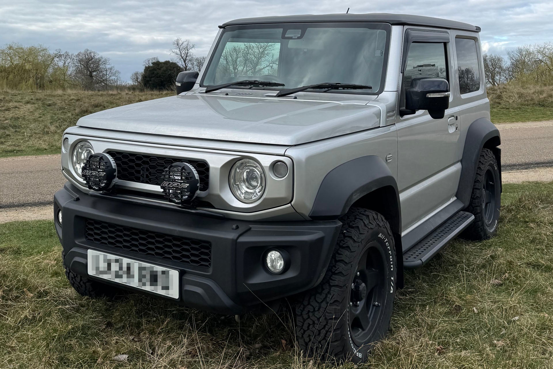 Silver Suzuki Jimny fitted with 16" BRADLEY V wheels and Clear LED Lighting