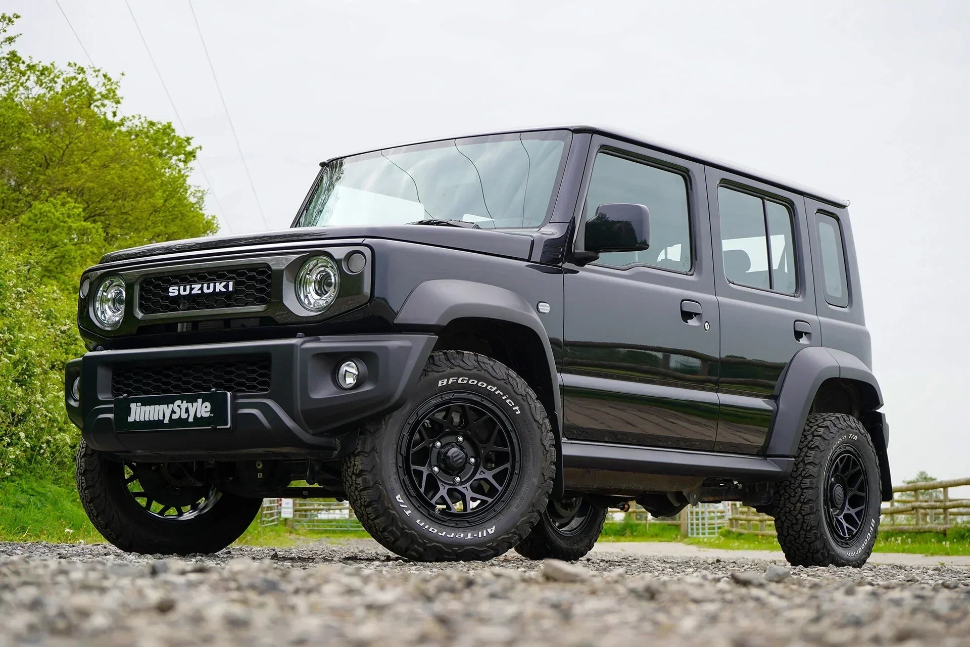 a modified 5-door Jimny with a Jimnystyle  Touring suspension kit, Pipercross air intake, Magpie M-01 wheels and various LED and interior accessories.