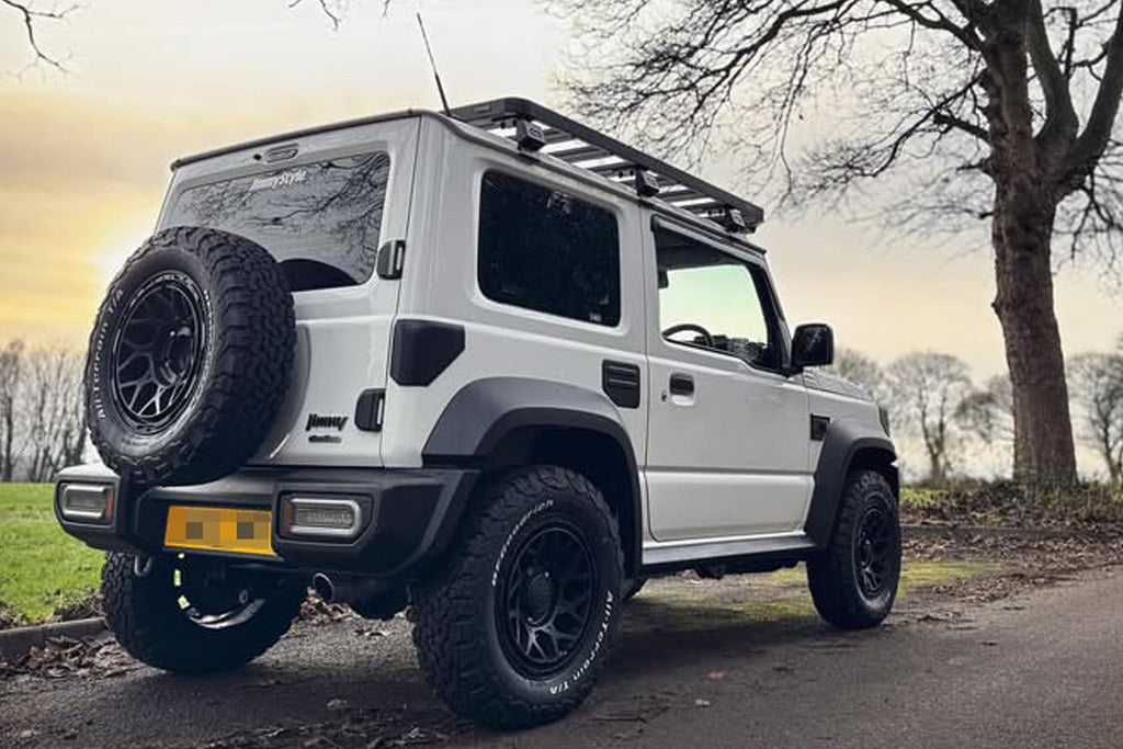 White Suzuki Jimny with Satin Black Magpie M-01 wheels and various accessories